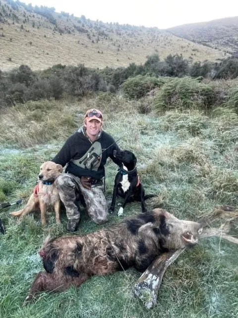 man with a hunting kill that he has caught in central otago